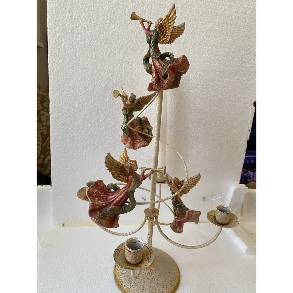 vintage "Herald Angels" candelabra, often associated with Christmas decor